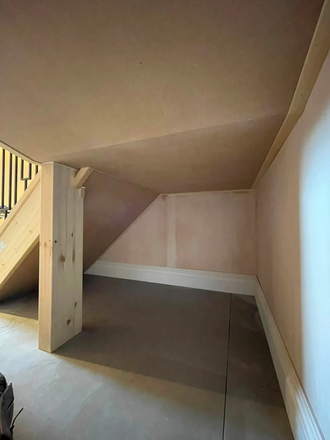 Under-stairs timber lining during construction